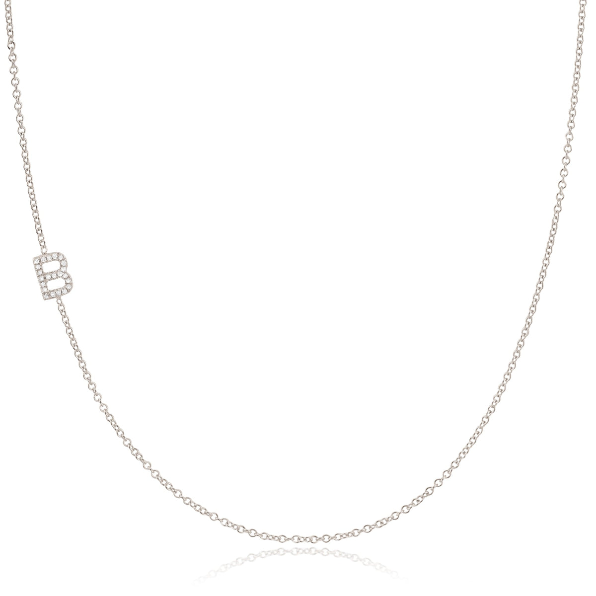 A white gold necklace with a B letter pave charm on a white background.