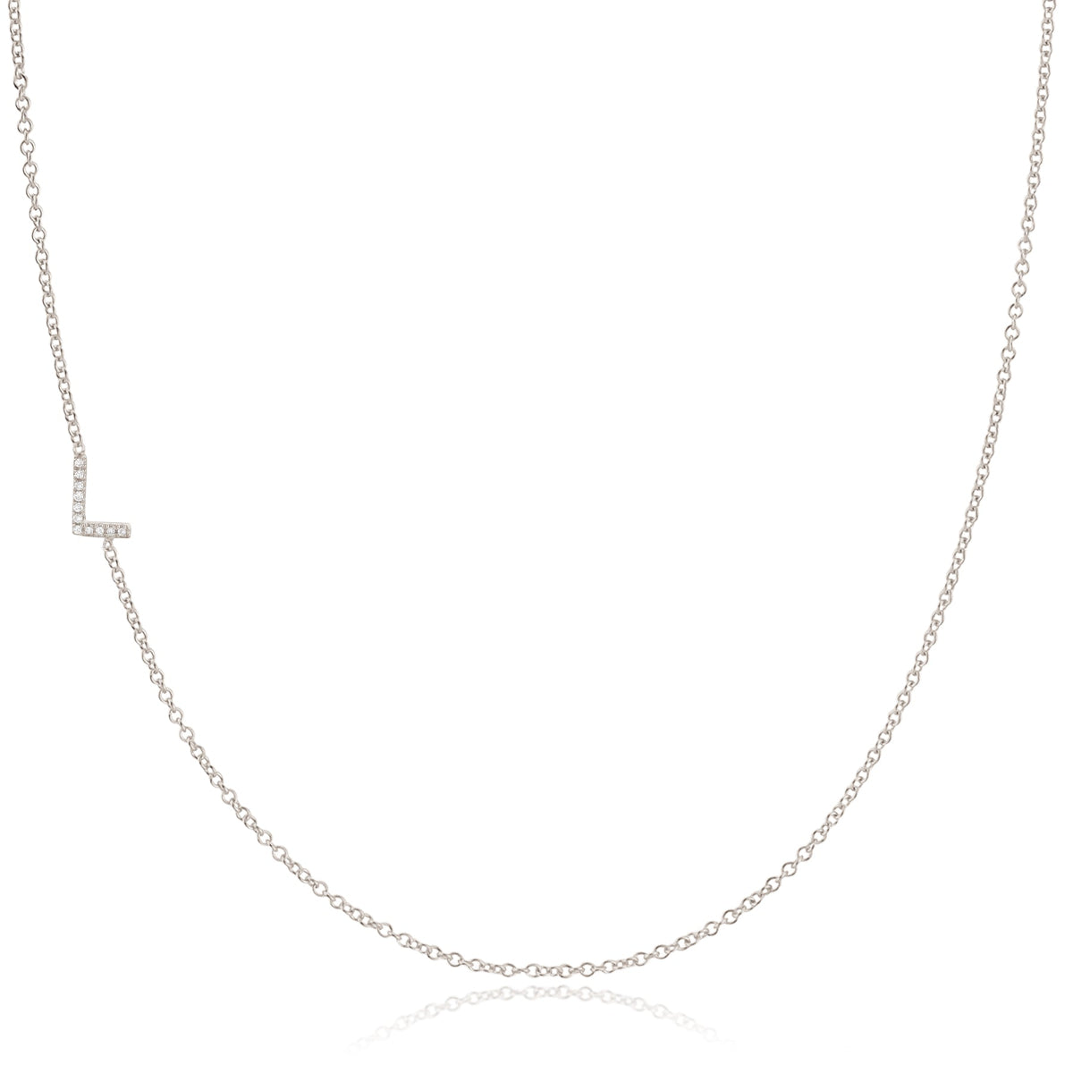A white gold necklace with a letter L pave charm on a white background.