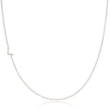 A white gold necklace with a letter L pave charm on a white background.
