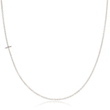 A white gold necklace with a T letter charm on a white background.
