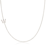 A white gold necklace with a W letter charm on a white background.