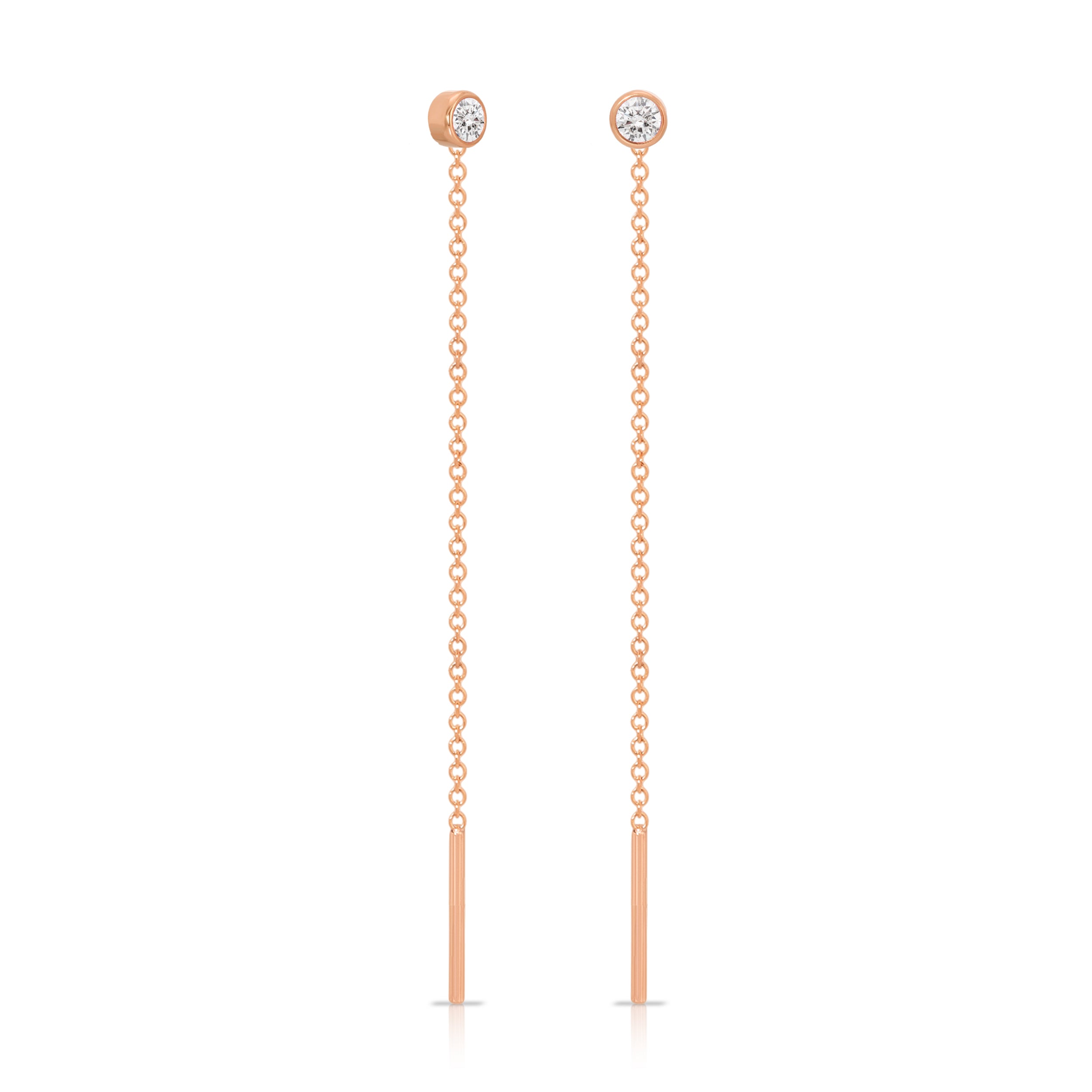 Rose gold chain earrings with small gemstones on a white background
