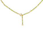 The back of a Confetti Necklace - Green on a white background. 