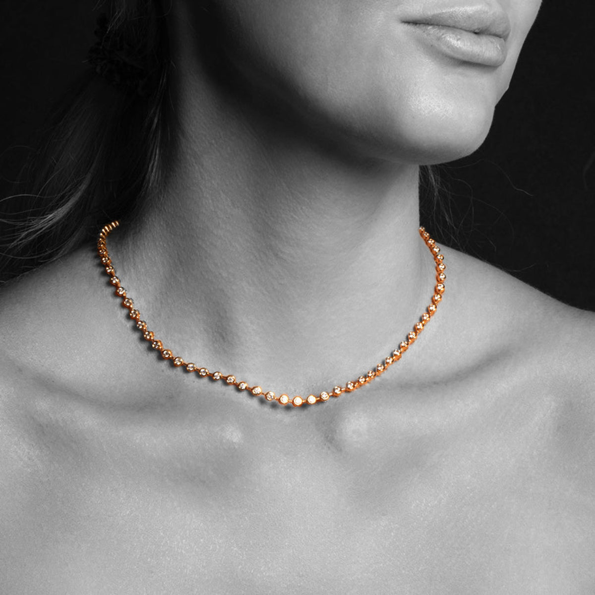 Close-up of a woman's neck wearing The Ultimate Diamond Necklace. 