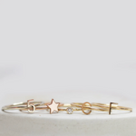 Five gold rings, including two Letter Rings (C and F), a Number 5 Ring, a Twinkle Twinkle Ring and a Birthstone Ring.