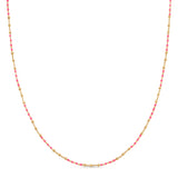 A Confetti Necklace - Pink on a white background. 