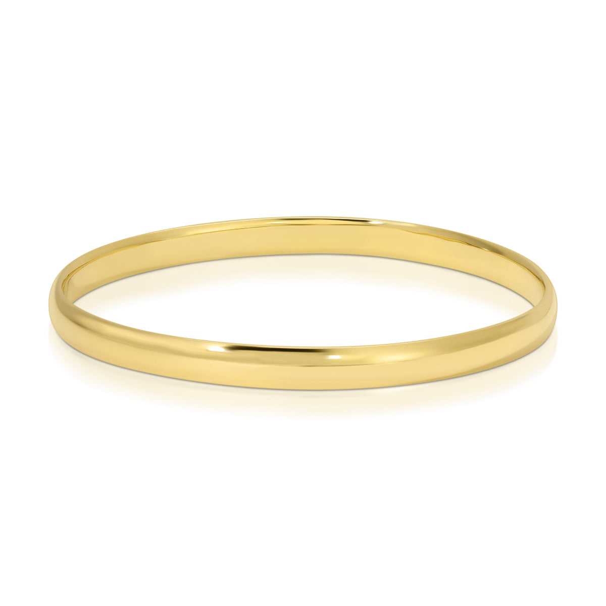 A gold vermeil For Keeps Bangle on a white background. 