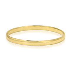 A gold vermeil For Keeps Bangle on a white background. 