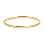 A vermeil gold Flirt Bangle on a white background. 