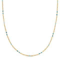 A Confetti Necklace - Blue on a white background. 