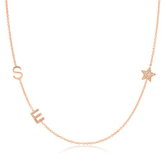 A Custom Gold Necklace in rose gold with two letter charms, a pavé E and an S positioned on the left side of the necklace, and a pavé star on the right side, on a white background.
