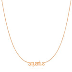 Petite Zodiac Necklace ‘aquarius’ in rose gold on a white background.