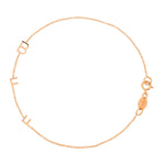 A rose gold BFF Bracelet in a cable chain bracelet on a white background. 
