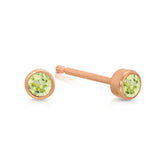 A pair of Birthstone Studs - Peridot (August) in rose gold on a white background.