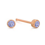 A pair of Birthstone Studs - Tanzanite (December) in rose gold on a white background.