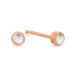 A pair of Birthstone Studs - Moonstone (June) in rose gold on a white background.