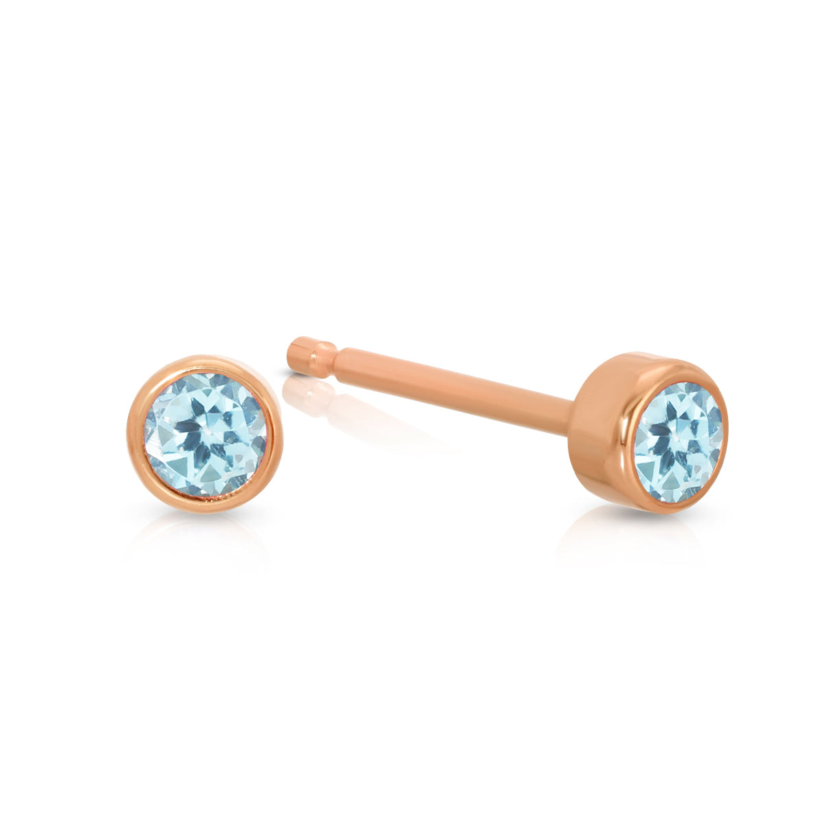 A pair of Birthstone Studs - Aquamarine (March) in rose gold on a white background. 