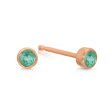A pair of Birthstone Studs - Emerald (May) in rose gold on a white background.