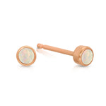 A pair of Birthstone Studs - Opal (October) in rose gold on a white background.
