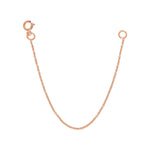 A rose gold Chain Extender on a white background. 