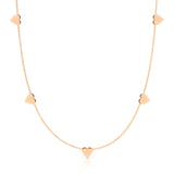 The 5 of Hearts Necklace in rose gold on a white background. 