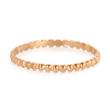 A Delicate Beaded Band in rose gold on a white background. 
