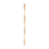 A Stardust Earring in rose gold on a white background. 