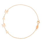A Mama Bracelet in rose gold with a cable chain on a white background. 