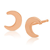 A pair of Charm Studs - Moon in rose gold on a white background.