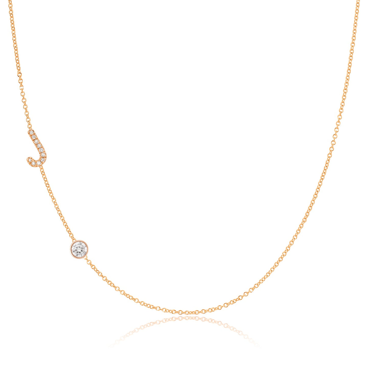 A Pavé Monogram Necklace with Diamond  and a letter J charm in rose gold on a white background.