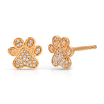 A pair of Pavé Charm Studs - Paw in rose gold on a white background.