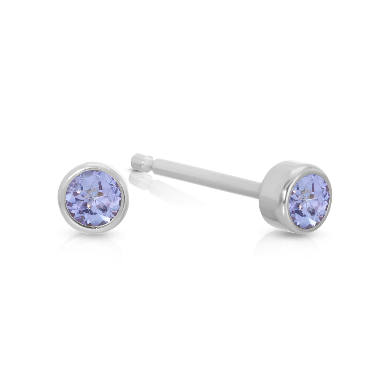 A pair of Birthstone Studs - Tanzanite (December) in white gold on a white background.