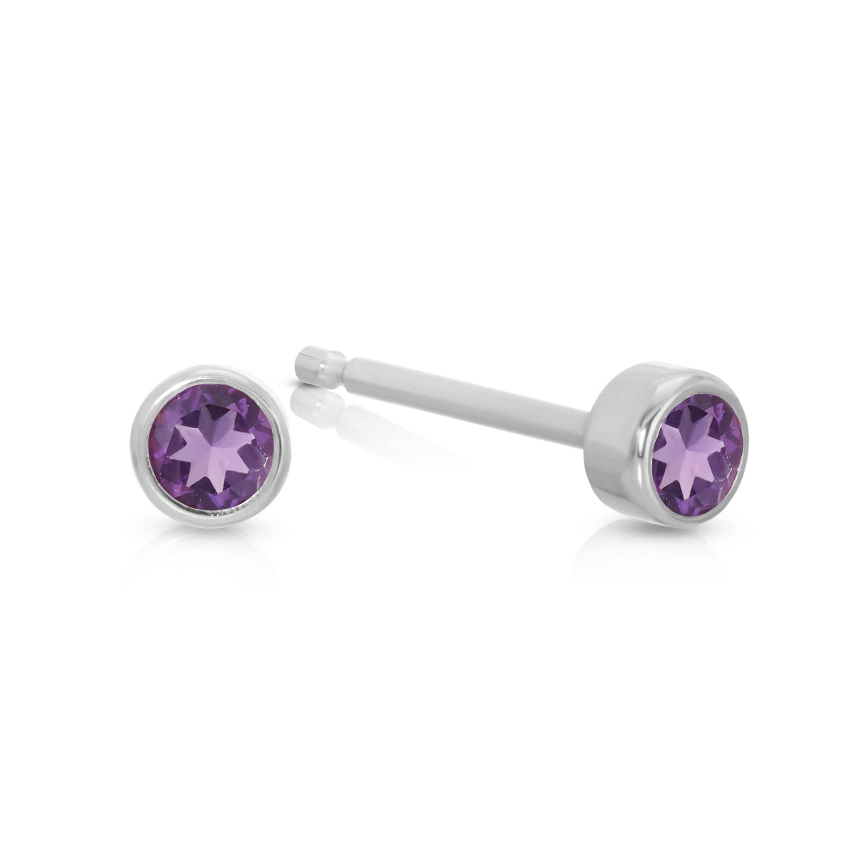 A pair of Birthstone Studs - Amethyst (February) in white gold on a white background.