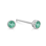 A pair of Birthstone Studs - Emerald (May) in white gold on a white background.