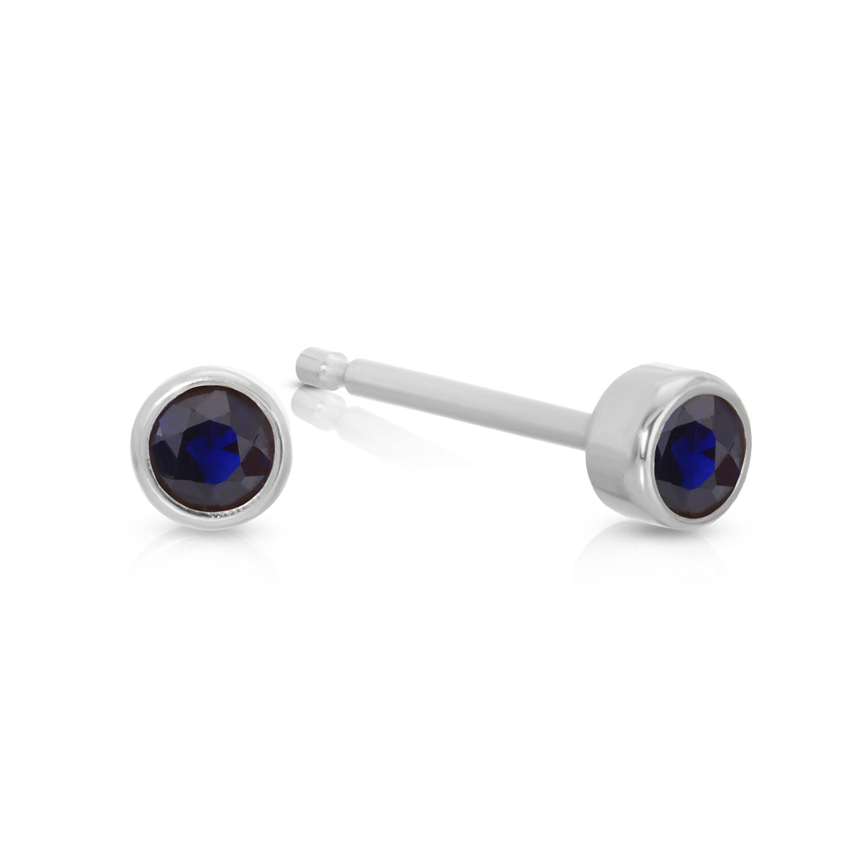 A pair of Birthstone Studs - Sapphire (September) in white gold on a white background.