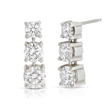 A pair of Triple Sec Diamond Earrings in white gold on a white background. 