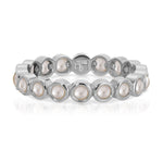 The Lily Bouquet Ring in white gold on a white background.