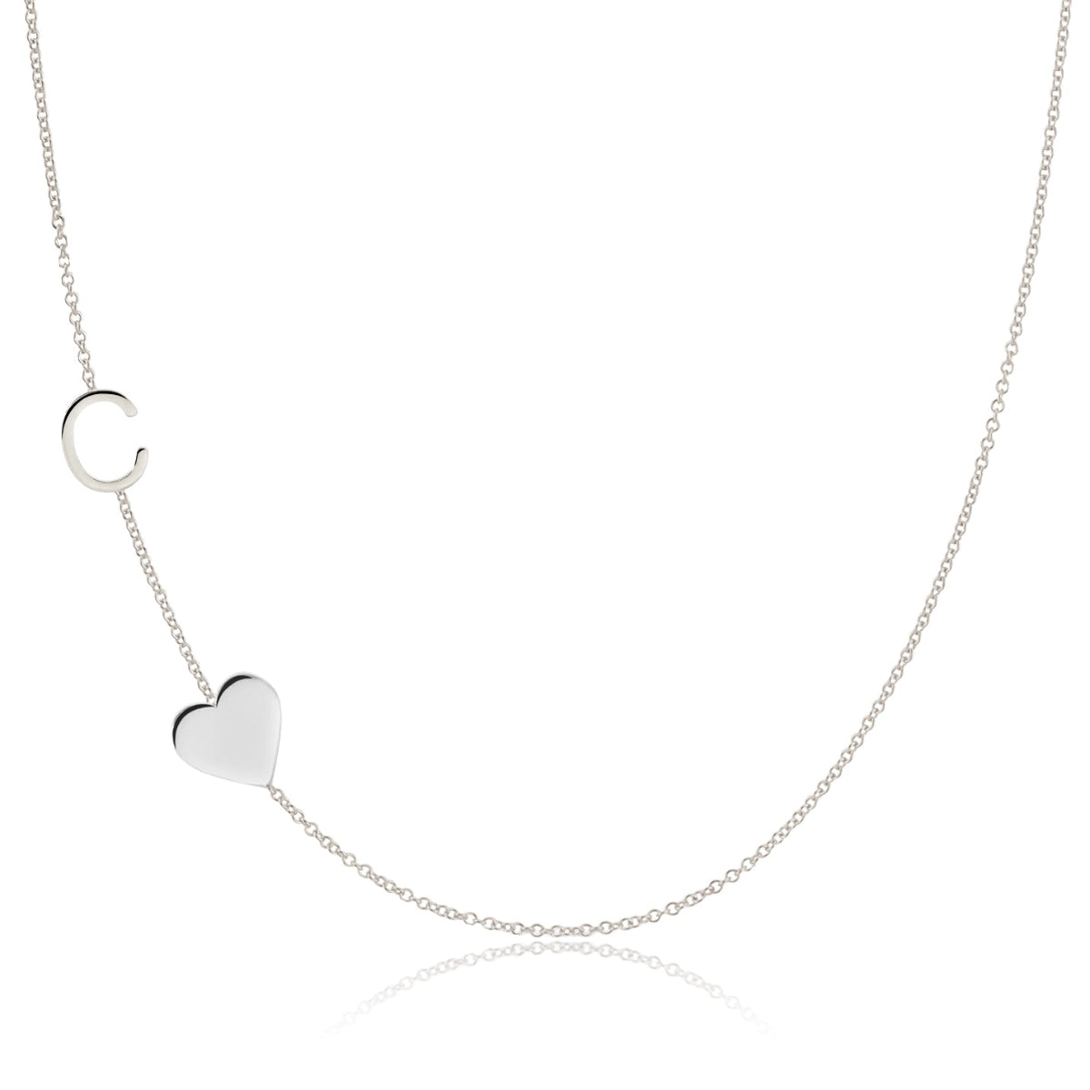 A Monogram Necklace with Heart White Gold and a letter C charm on a white background.