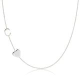 A Monogram Necklace with Heart White Gold and a letter C charm on a white background.