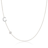 A Pavé Monogram Necklace with Diamond  and a letter C charm in white gold on a white background.