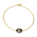 A Baroque Black Pearl Bangle on a white background. 