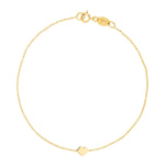 A yellow gold Lip Bracelet on a white background. 