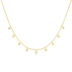 A yellow gold Stardust Diamond Necklace on a white background. 