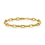 A Bold Link Bracelet in yellow gold on a white background. 
