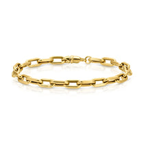 A Bold Link Bracelet in yellow gold on a white background. 