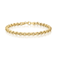 A Rolo Bracelet in yellow gold against on a white background. 