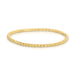 A Delicate Twist Band in yellow gold on a white background. 