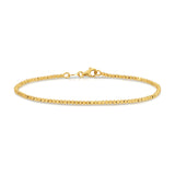 A Diamond Cut Bracelet in yellow gold on a white background. 