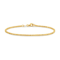 A Diamond Cut Bracelet in yellow gold on a white background. 