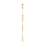 A Stardust Earring in yellow gold on a white background. 